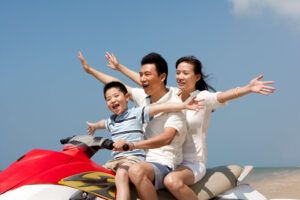 Family riding a rental jet ski.