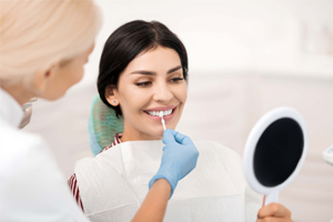 lady smiling getting her teeth whitened